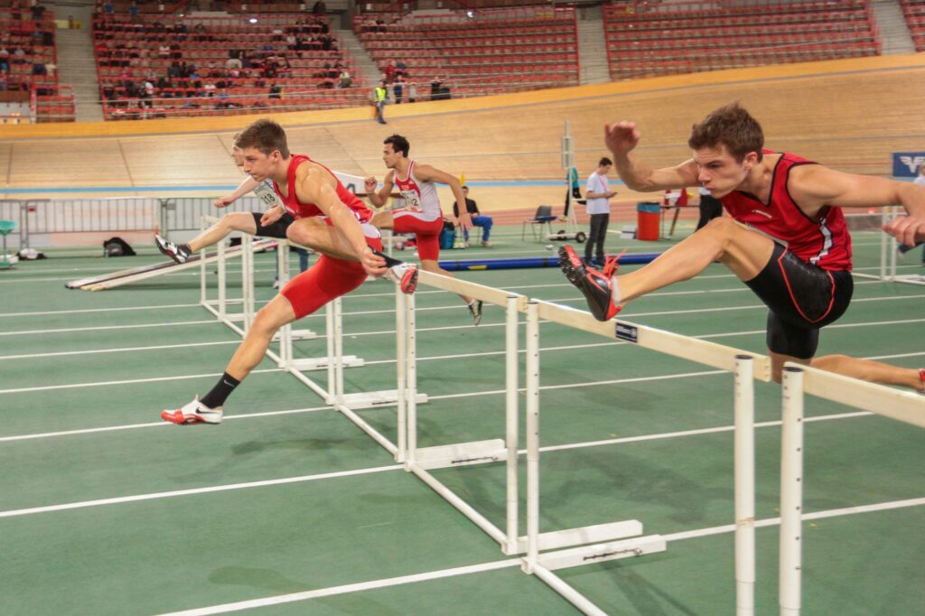 School boys competing in a hurdles event