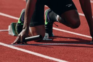 Sprinter in the starting blocks in the track and field relay