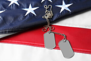 Army dog tags on an American Flag